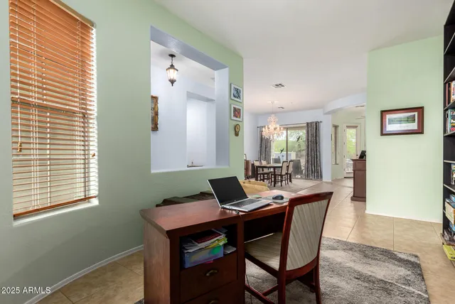 a bathroom with a granite countertop sink a toilet and a mirror