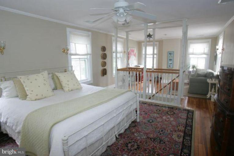 223 Hawthorn Road Baltimore, MD 21210 - Photo 15 of 30 a bed room with a bed and a chandelier