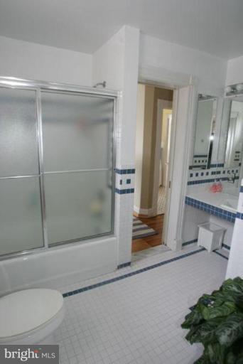 223 Hawthorn Road Baltimore, MD 21210 - Photo 17 of 30 a bathroom with a tub and shower