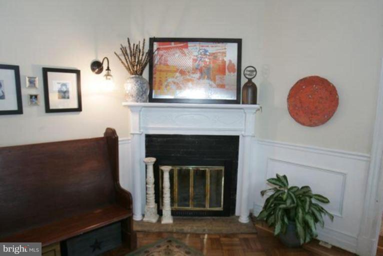 223 Hawthorn Road Baltimore, MD 21210 - Photo 3 of 30 a living room with furniture and a fireplace