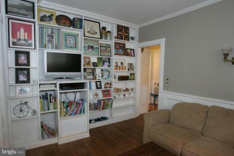 223 Hawthorn Road Baltimore, MD 21210 - Photo 9 of 30 a living room with furniture workspace and a flat screen tv