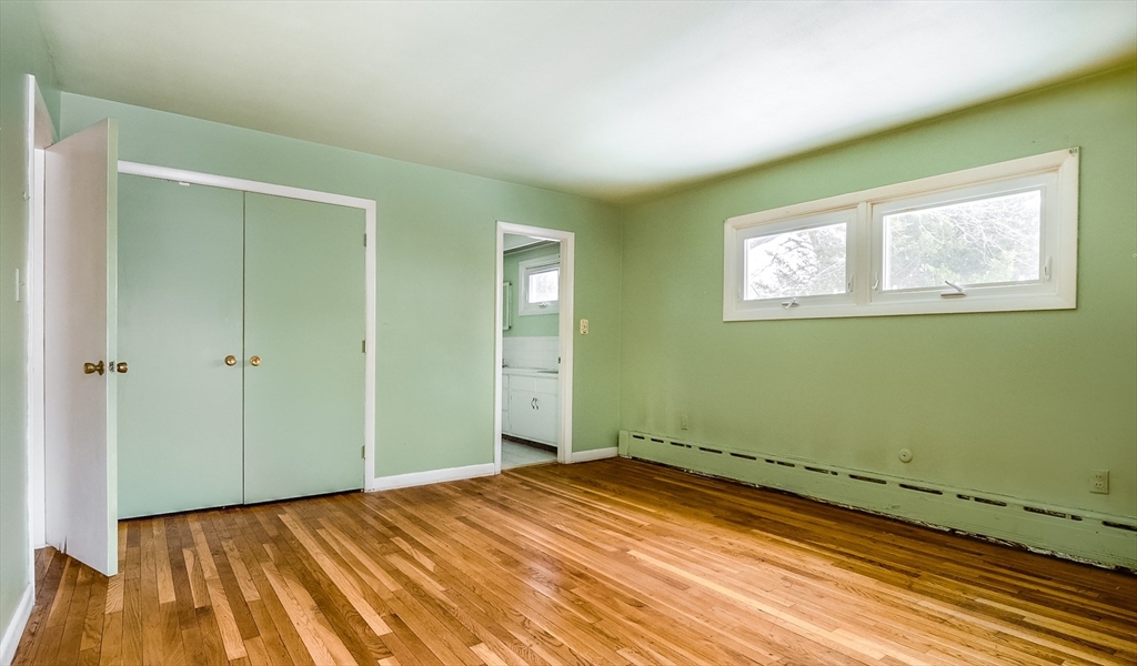 9 Cloverleaf Road Leominster, MA 01453 - Photo 13 of 19 a view of a room with wooden floor and bathroom