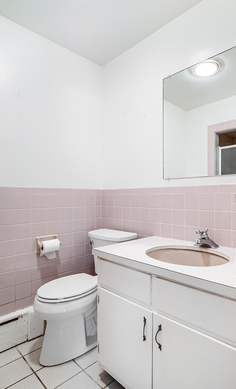9 Cloverleaf Road Leominster, MA 01453 - Photo 16 of 19 a bathroom with a sink a toilet and a mirror