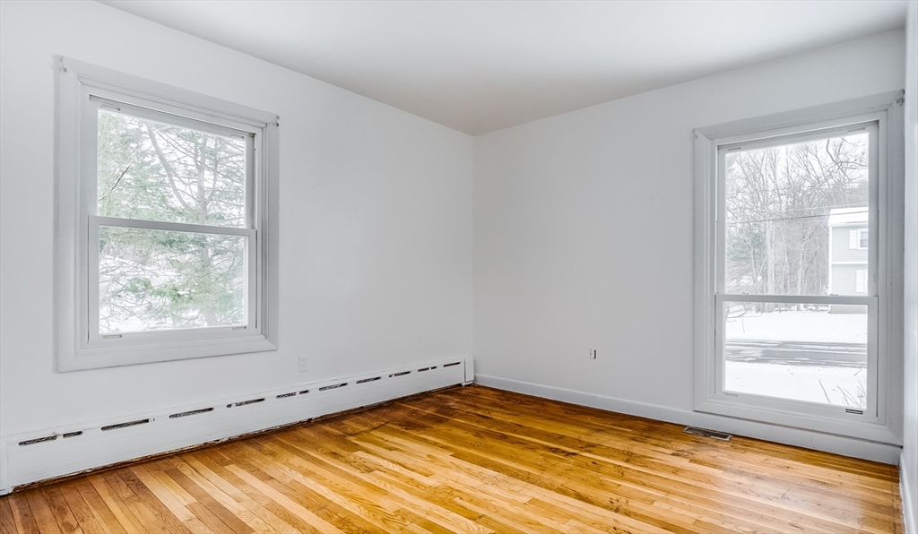 9 Cloverleaf Road Leominster, MA 01453 - Photo 17 of 19 a view of empty room with wooden floor and fan