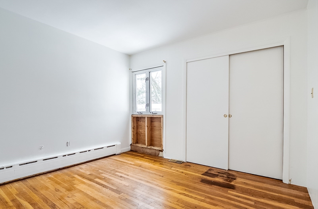 9 Cloverleaf Road Leominster, MA 01453 - Photo 18 of 19 a view of an empty room with wooden floor