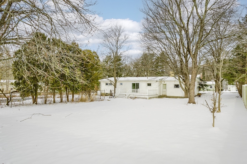 9 Cloverleaf Road Leominster, MA 01453 - Photo 2 of 19 a view of a large white house with a large tree