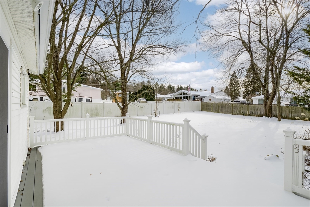 9 Cloverleaf Road Leominster, MA 01453 - Photo 4 of 19 a view of white house covered in snow