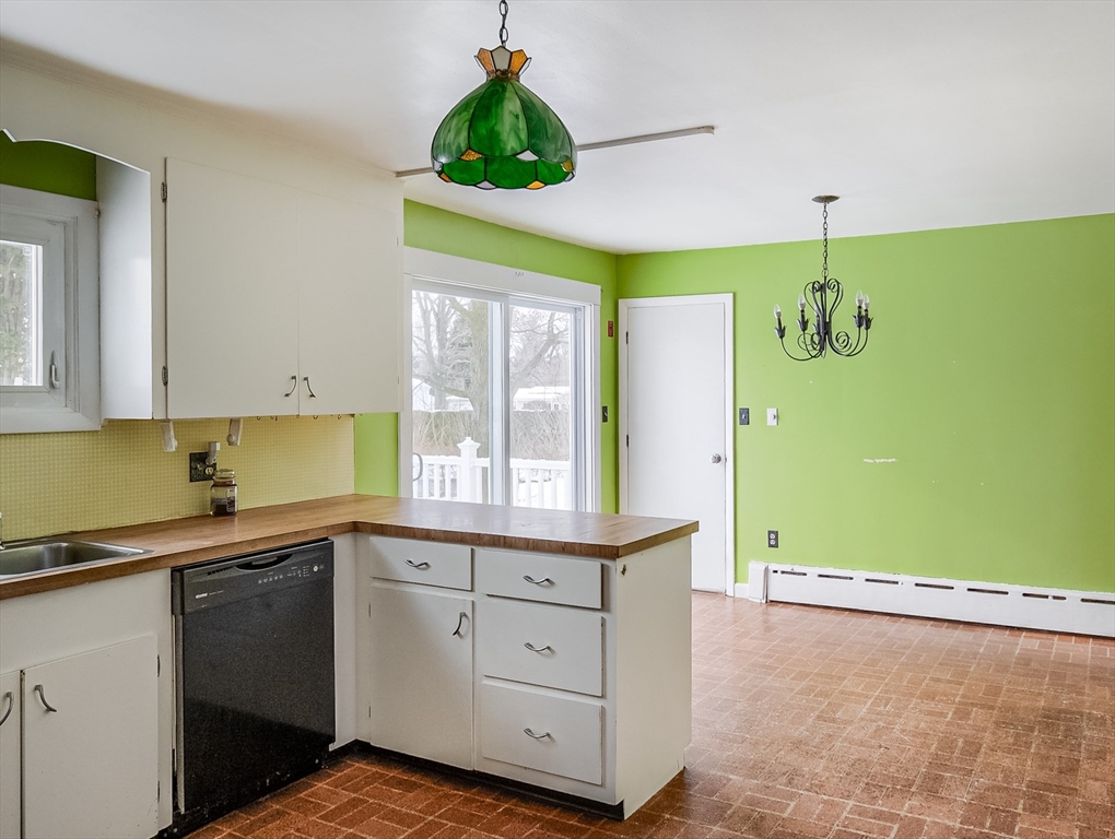 9 Cloverleaf Road Leominster, MA 01453 - Photo 7 of 19 a kitchen with a sink and cabinets