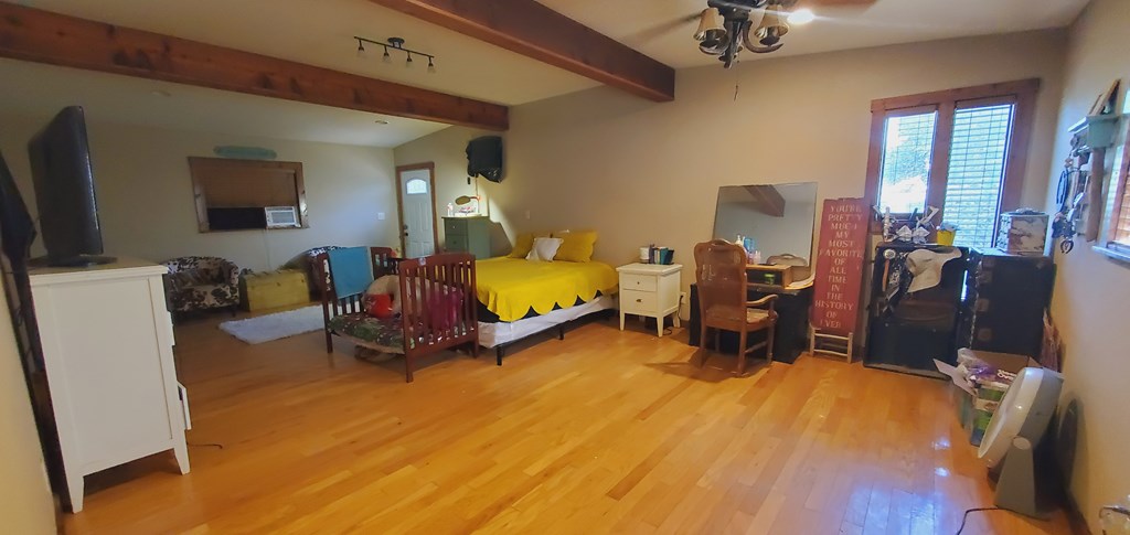 208 Houston Street Menard, TX 76859 - Photo 14 of 17 a bedroom with furniture and a flat screen tv