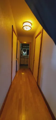 a view of empty room with a fireplace