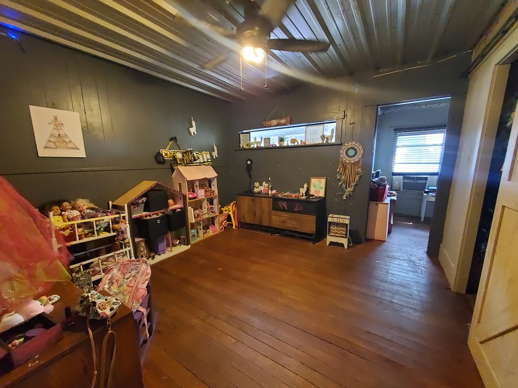 208 Houston Street Menard, TX 76859 - Photo 5 of 17 a living room with furniture and a wooden floor