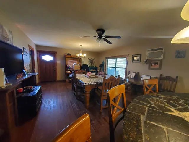 a living room with lots of furniture and a flat screen tv