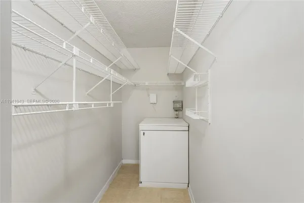 a view of a storage & utility room with washer and dryer