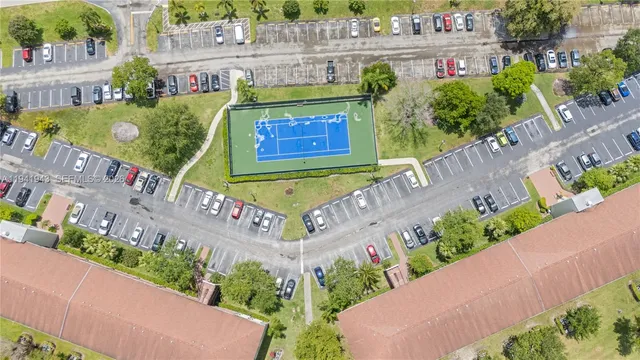 a sign that is sitting in front of flowers