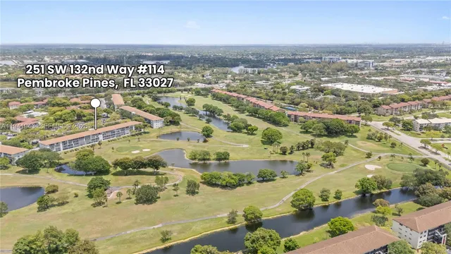 an aerial view of residential building with outdoor space and lake view