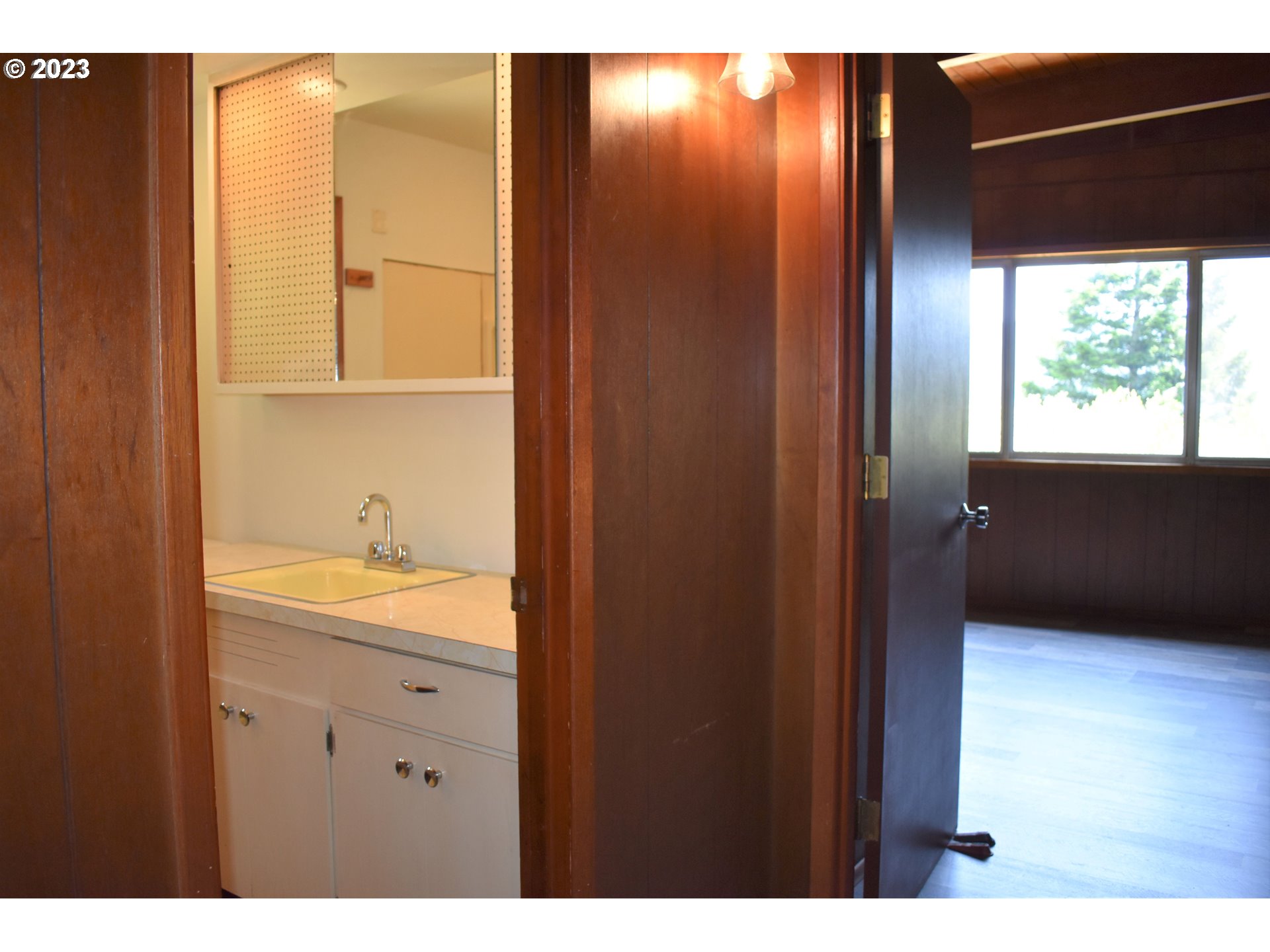 95144 Marchmont Road Gold Beach, OR 97444 - Photo 14 of 34 a bathroom with a sink and a mirror