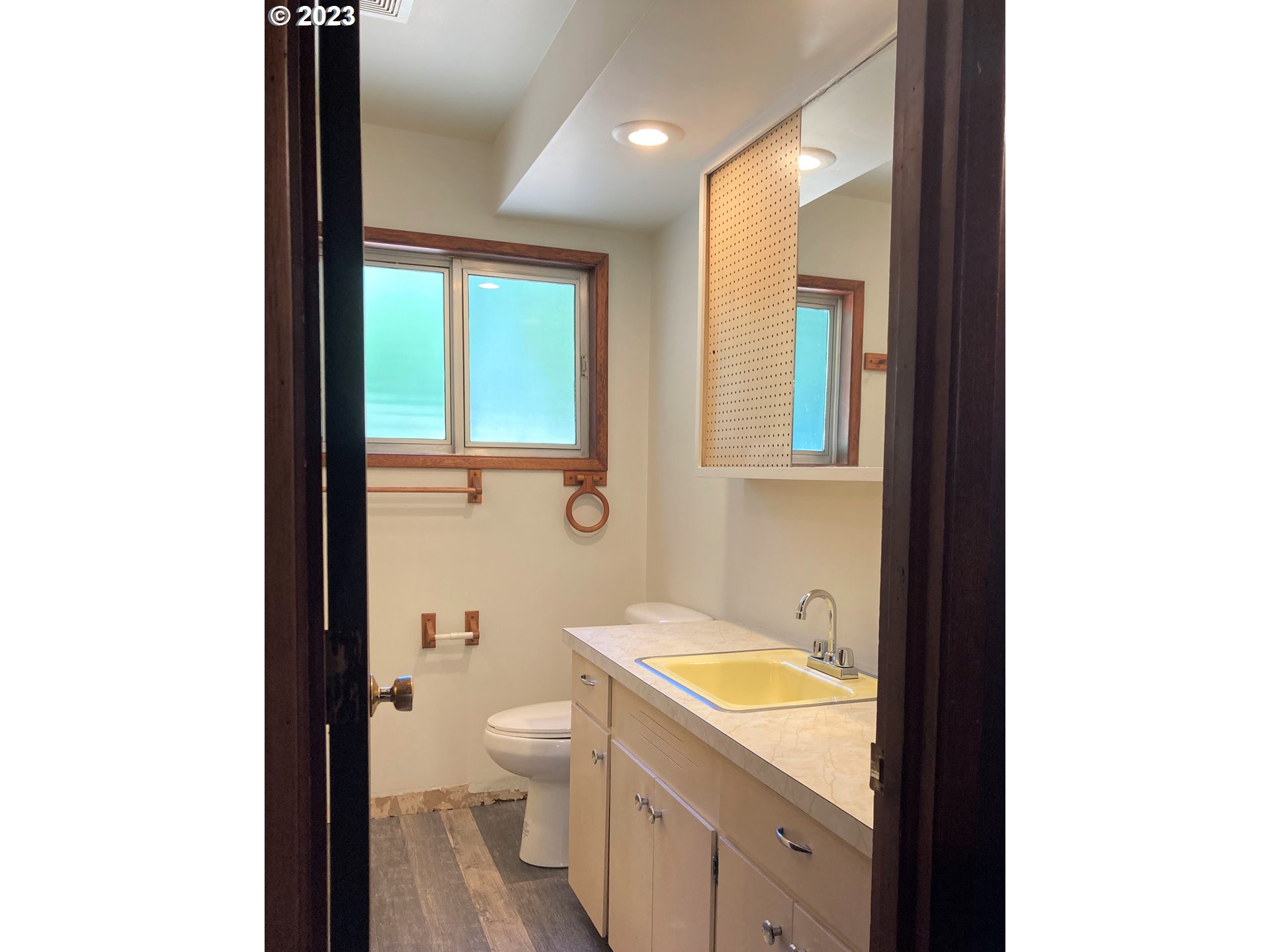 95144 Marchmont Road Gold Beach, OR 97444 - Photo 15 of 34 a spacious bathroom with a granite countertop toilet a sink and a mirror