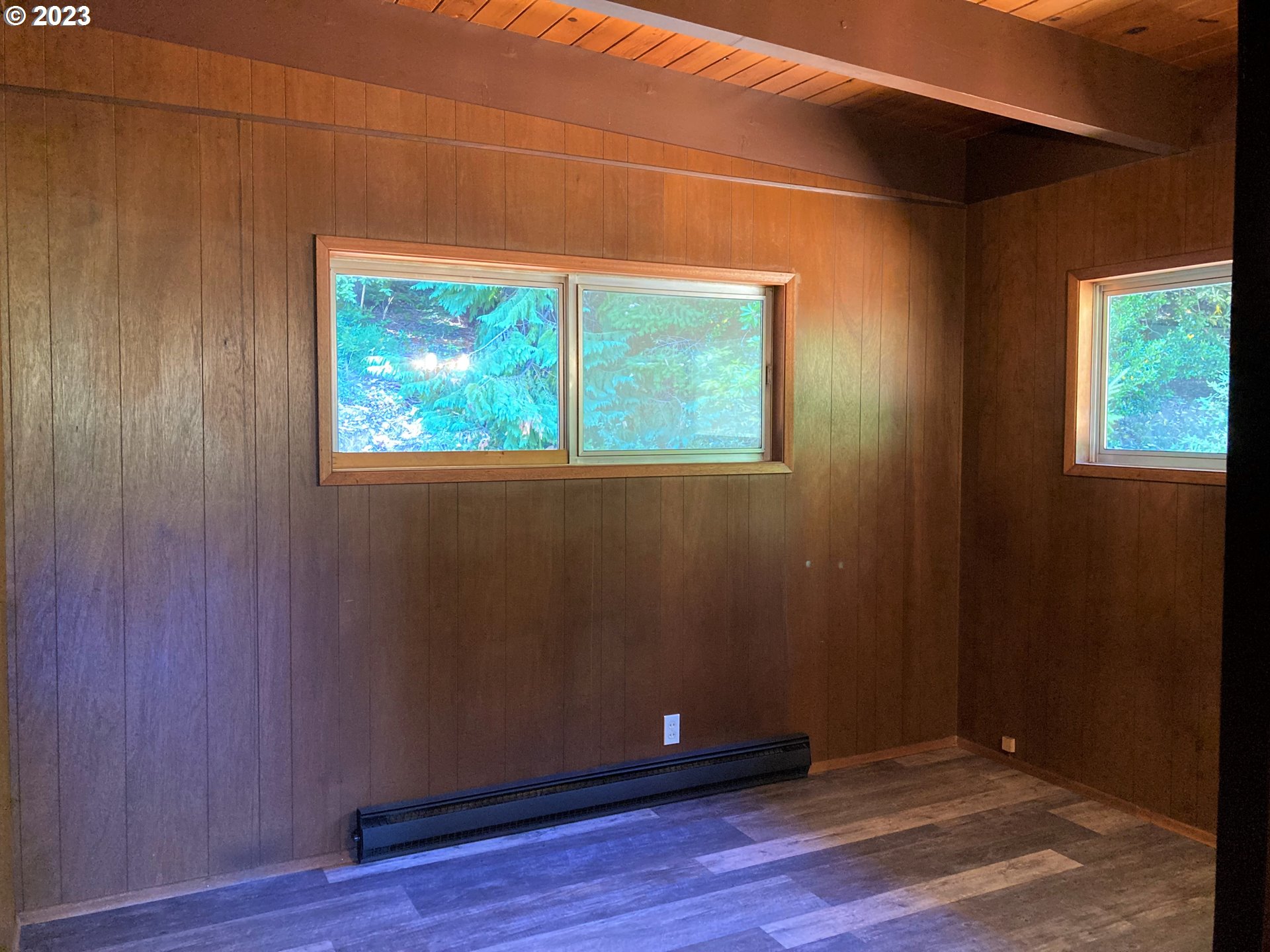 95144 Marchmont Road Gold Beach, OR 97444 - Photo 17 of 34 an empty room with wooden floor and windows