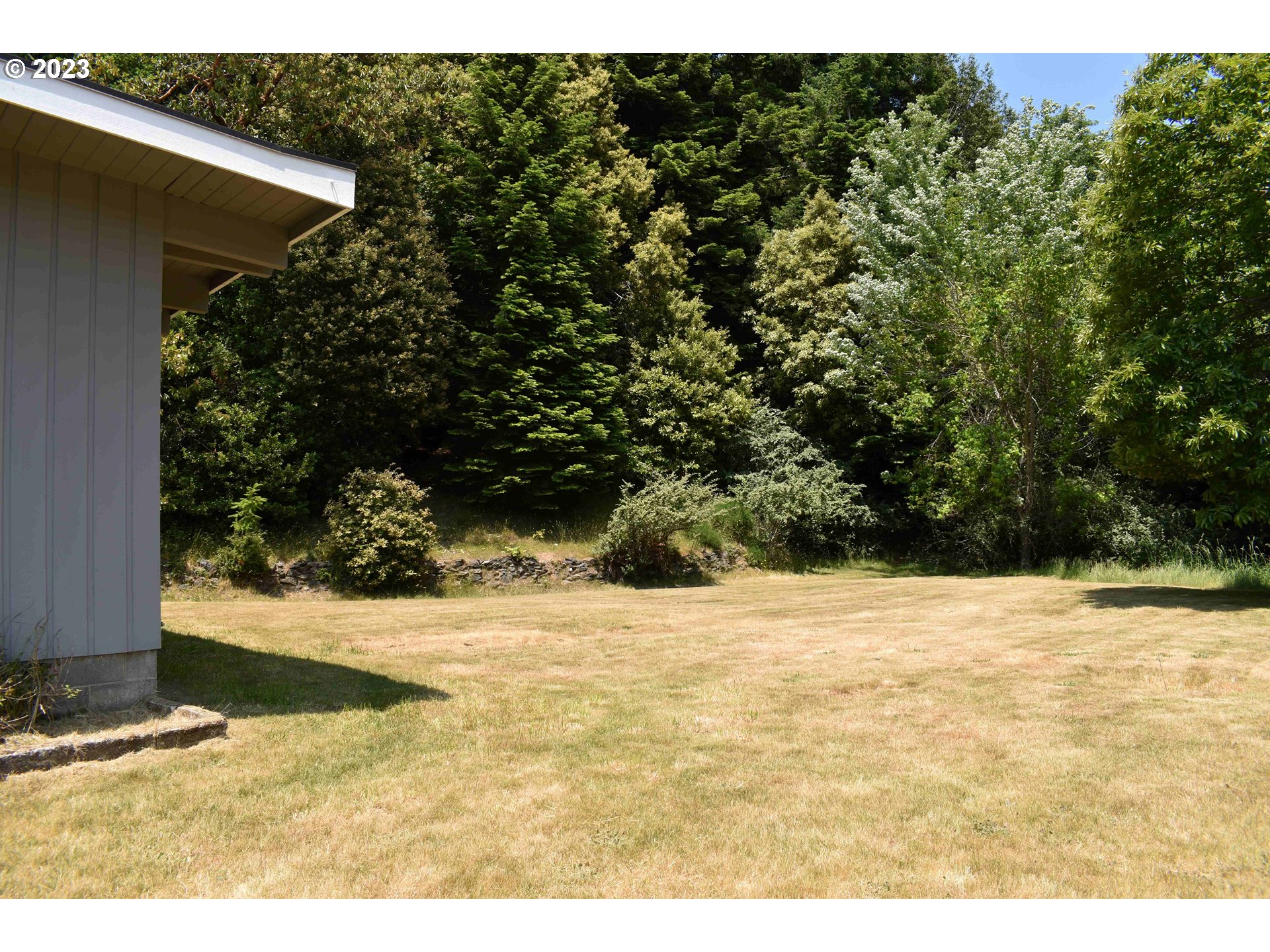 95144 Marchmont Road Gold Beach, OR 97444 - Photo 23 of 34 a view of a backyard of a house