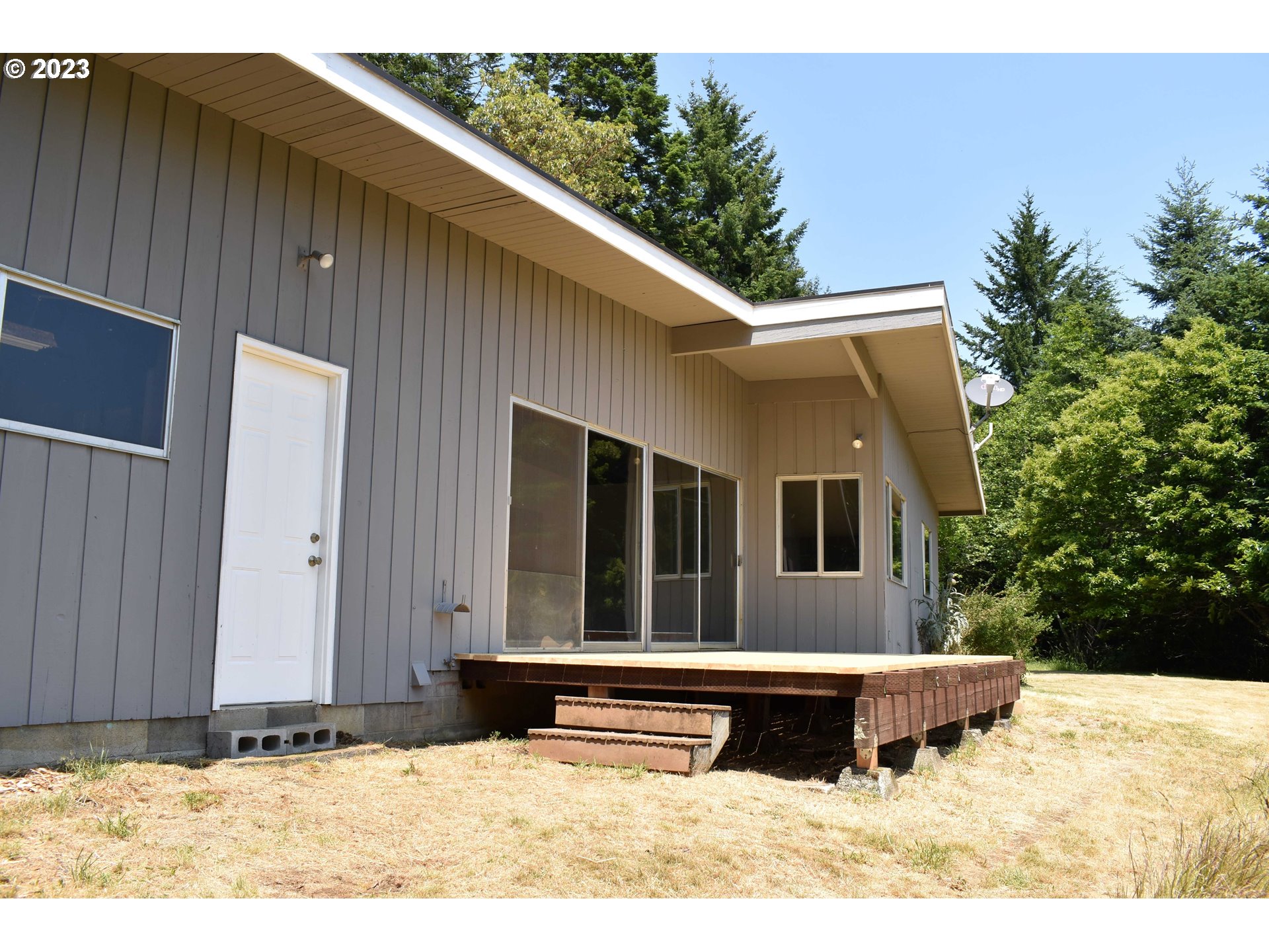95144 Marchmont Road Gold Beach, OR 97444 - Photo 25 of 34 a view of a house with a yard
