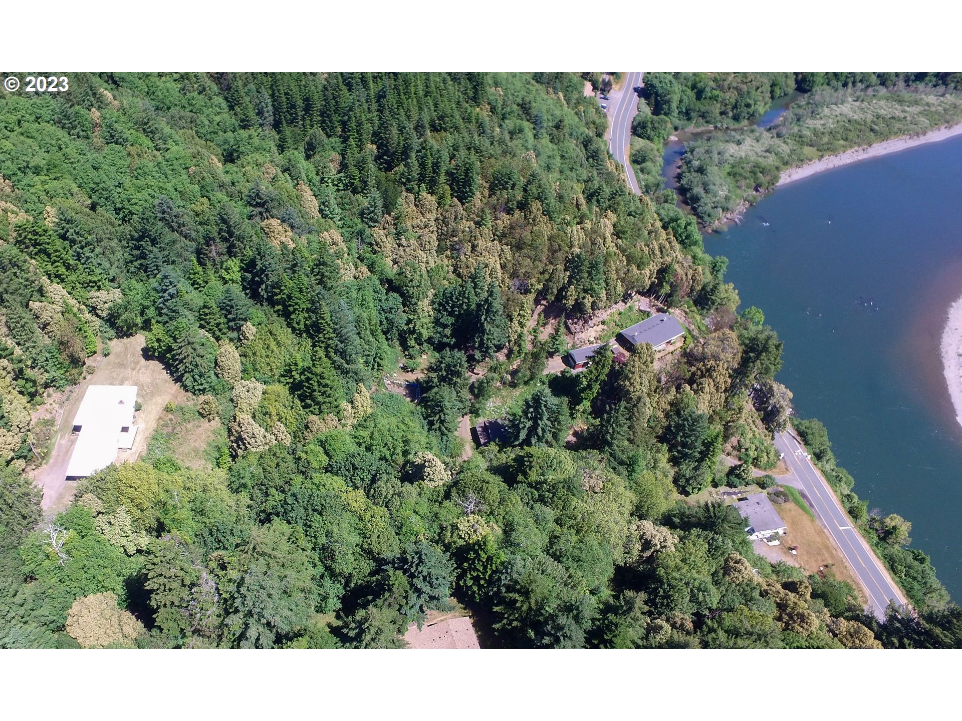 95144 Marchmont Road Gold Beach, OR 97444 - Photo 26 of 34 a view of a lot of trees and bushes