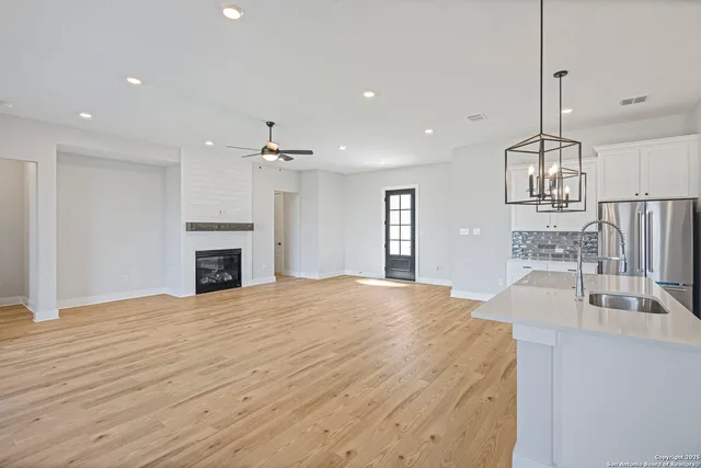 a view of kitchen with sink and microwave