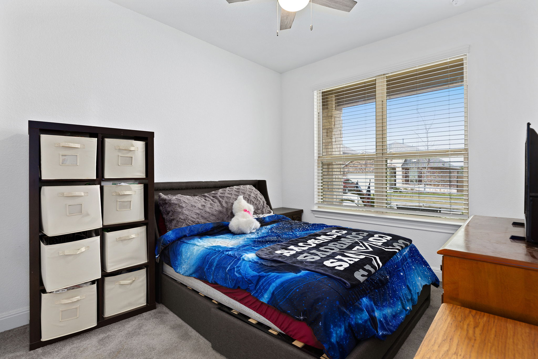 116 Raleigh Drive Georgetown, TX 78633 - Photo 19 of 28 A well-lit bedroom offering a cozy atmosphere, complete with a window for natural illumination.