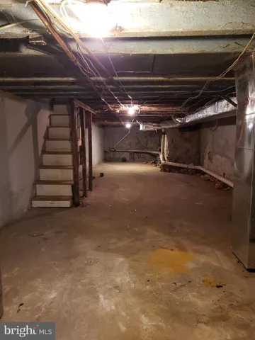 a view of an empty room with stairs