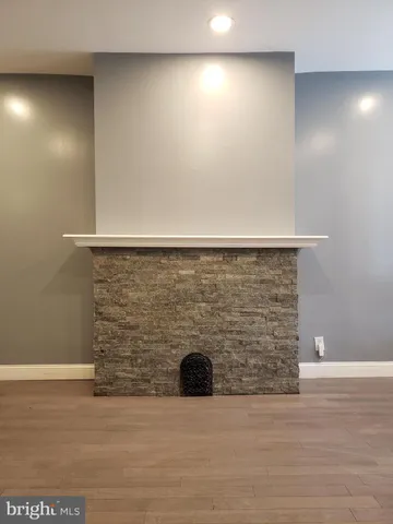 a view of water heater and wooden floor