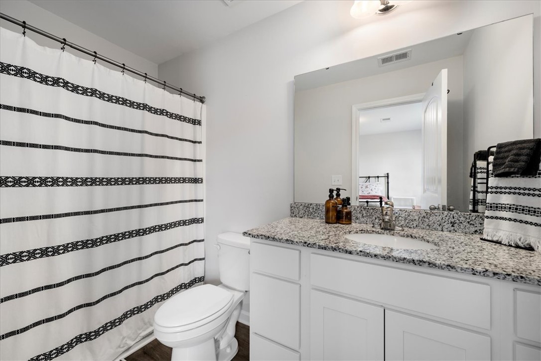 117 Adger Road Pendleton, SC 29670 - Photo 19 of 36 This bathroom features elegant granite counters and durable tile flooring, providing both style and function.