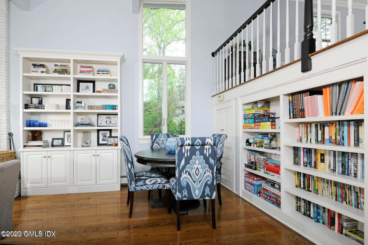 16 Crescent Road Riverside, CT 06878 - Photo 11 of 33 a view of a workspace with furniture and a book shelf