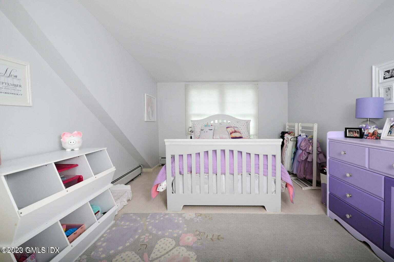 16 Crescent Road Riverside, CT 06878 - Photo 14 of 33 a bedroom with furniture and a window