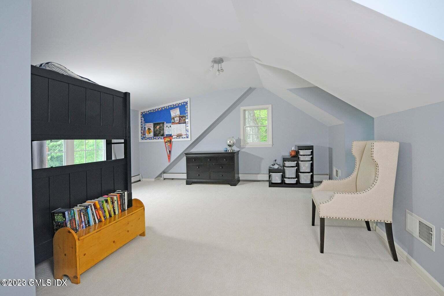 16 Crescent Road Riverside, CT 06878 - Photo 20 of 33 a living room with furniture and a flat screen tv