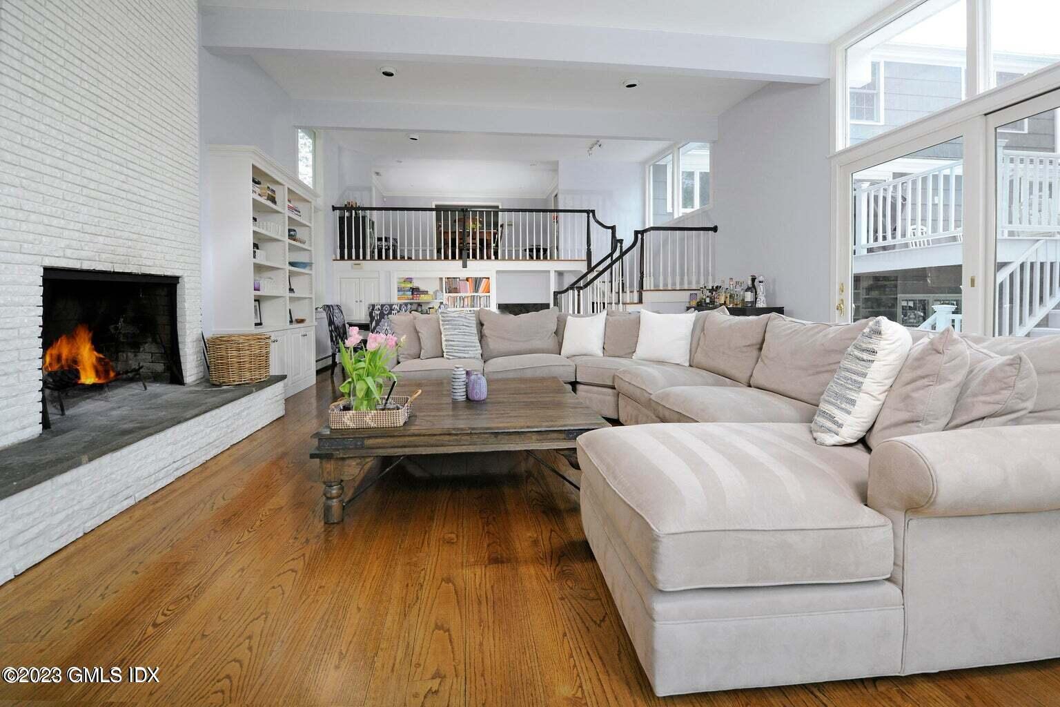 16 Crescent Road Riverside, CT 06878 - Photo 21 of 33 a living room with furniture and a fireplace