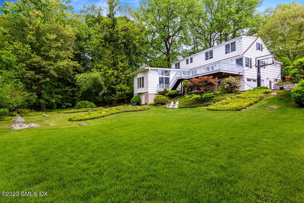 16 Crescent Road Riverside, CT 06878 - Photo 3 of 33 a front view of house with yard and green space