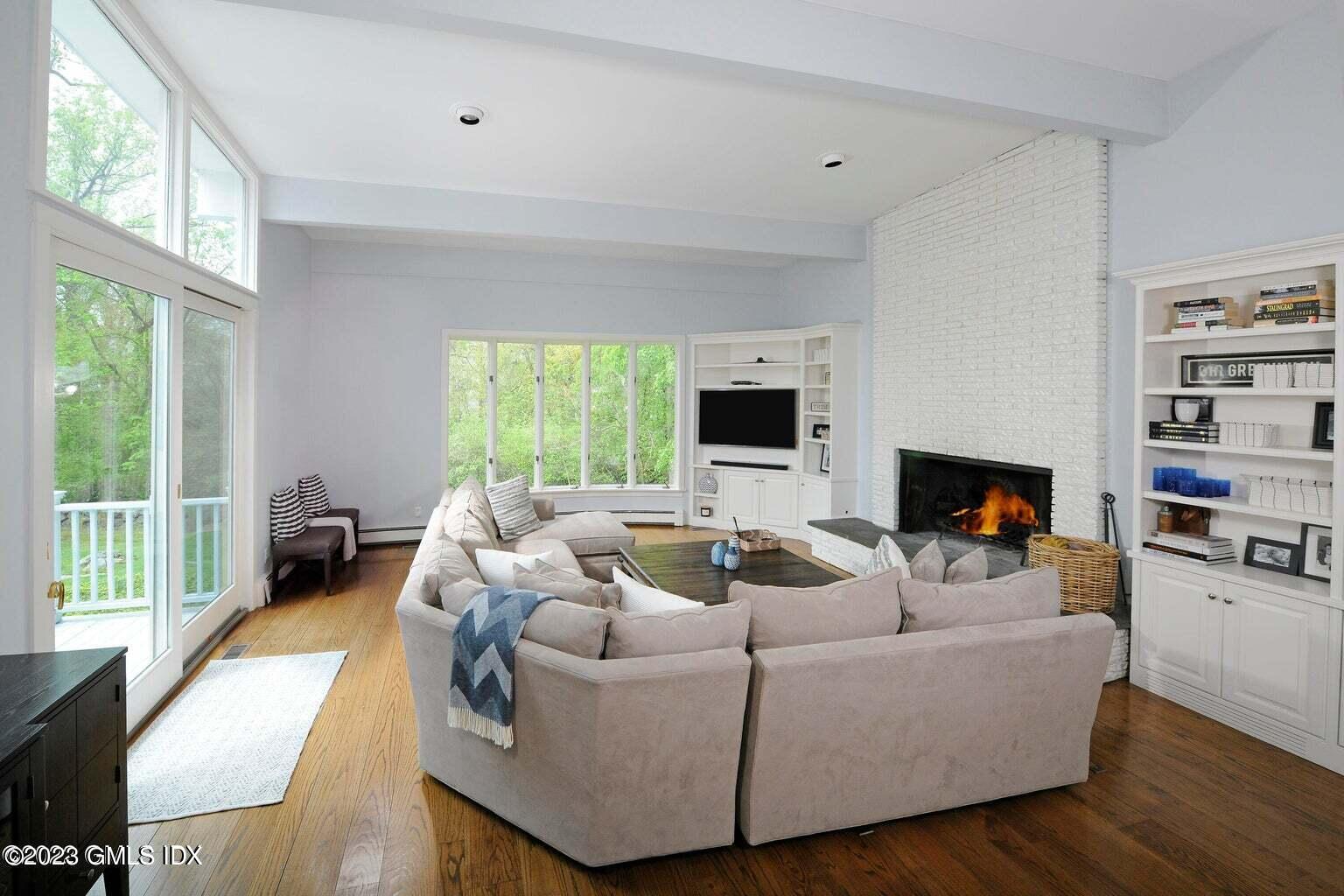 16 Crescent Road Riverside, CT 06878 - Photo 10 of 33 a living room with furniture and a fireplace