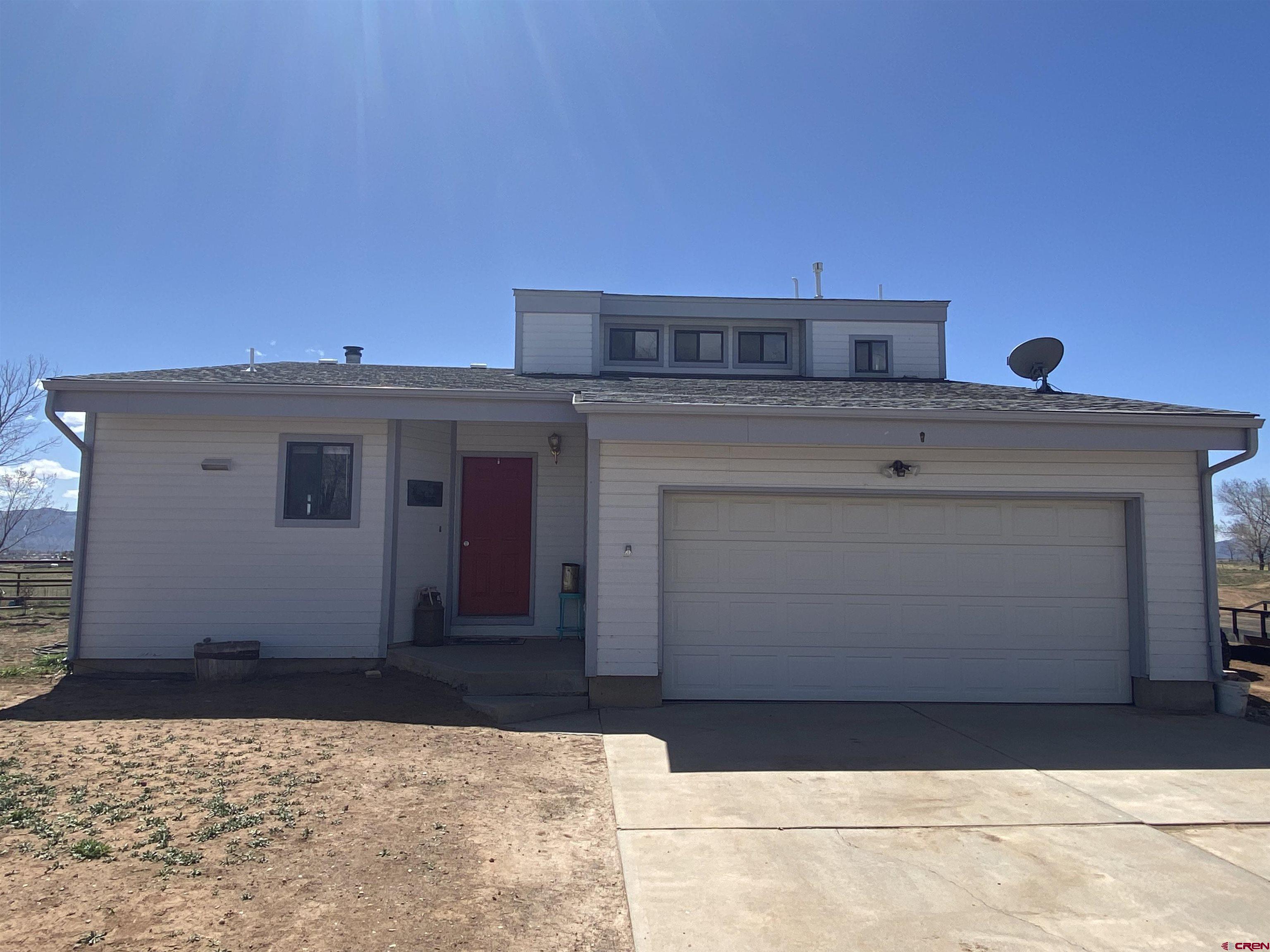 24020 County Rd M Cortez, CO 81321 - Photo 1 of 18 a front view of a house