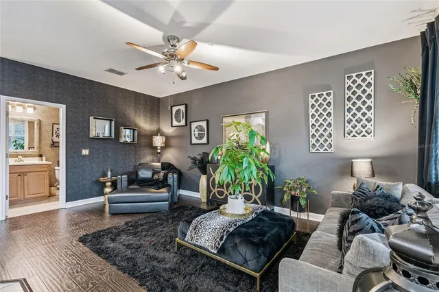 a view of a livingroom with workspace and a window