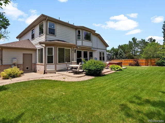 a view of a backyard with a garden and plants