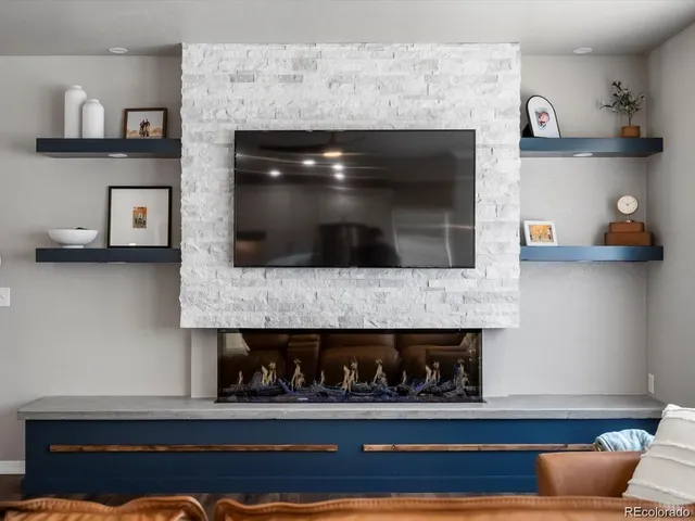 a room with fireplace and a wooden floor