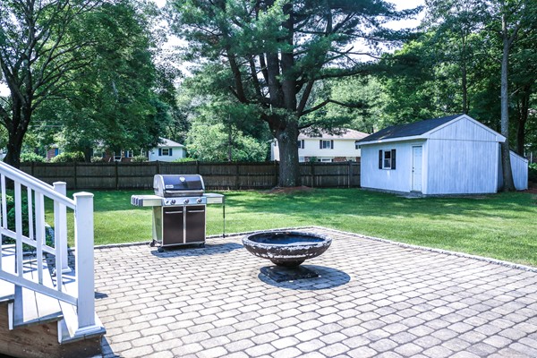 26 Livoli Road Framingham, MA 01701 - Photo 11 of 13 a view of backyard with a garden and trees