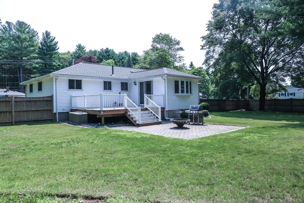 26 Livoli Road Framingham, MA 01701 - Photo 13 of 13 a view of backyard of house with wooden deck and furniture