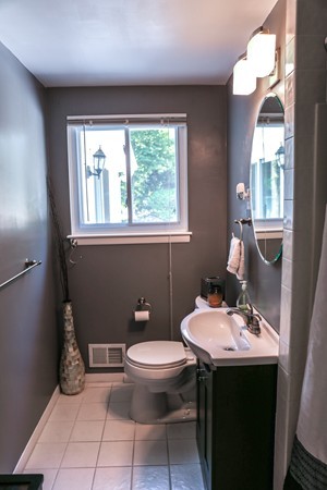 26 Livoli Road Framingham, MA 01701 - Photo 4 of 13 a bathroom with a sink a toilet and mirror