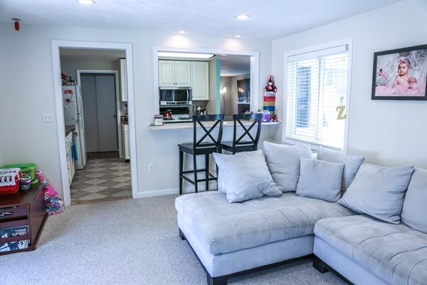 26 Livoli Road Framingham, MA 01701 - Photo 7 of 13 a living room with furniture and a flat screen tv