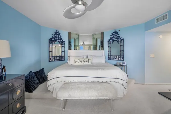 a spacious bathroom with a granite countertop sink mirror and shower