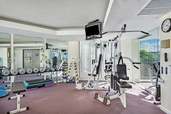 a view of a workspace with furniture and wooden floor