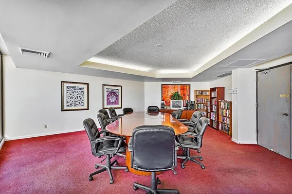 a view of a swimming pool with a lounge chair