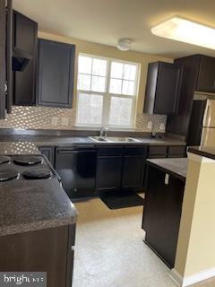 42304 Shoover Square Chantilly, VA 20152 - Photo 8 of 21 a kitchen with a sink a stove and a refrigerator