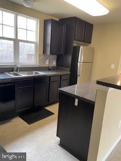 42304 Shoover Square Chantilly, VA 20152 - Photo 9 of 21 a kitchen with a sink a refrigerator and window