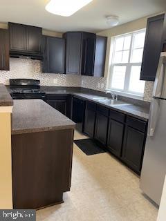 42304 Shoover Square Chantilly, VA 20152 - Photo 10 of 21 a kitchen with a sink and a stove top oven